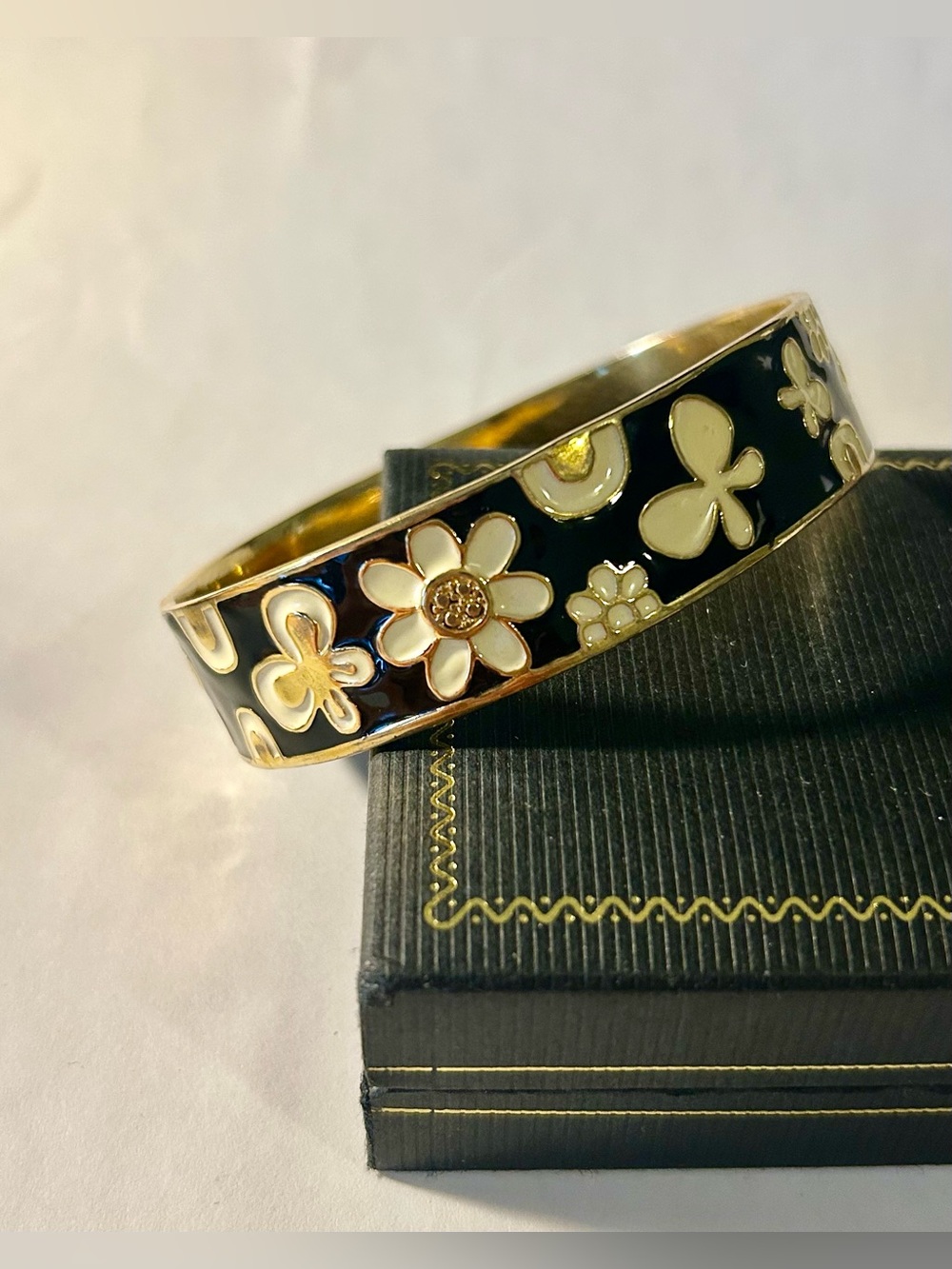 White Flower on Black enamel gold tone oval bracelet